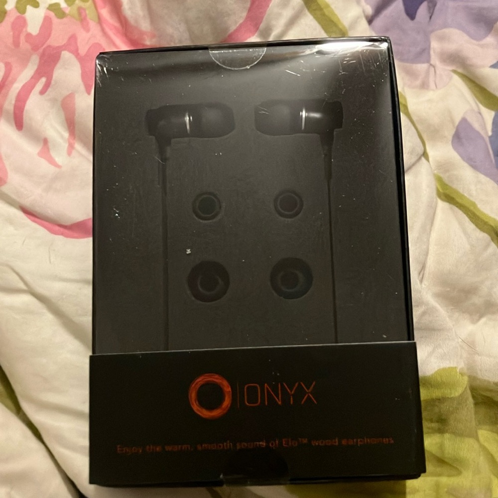 A pair of headphones that are black never before used